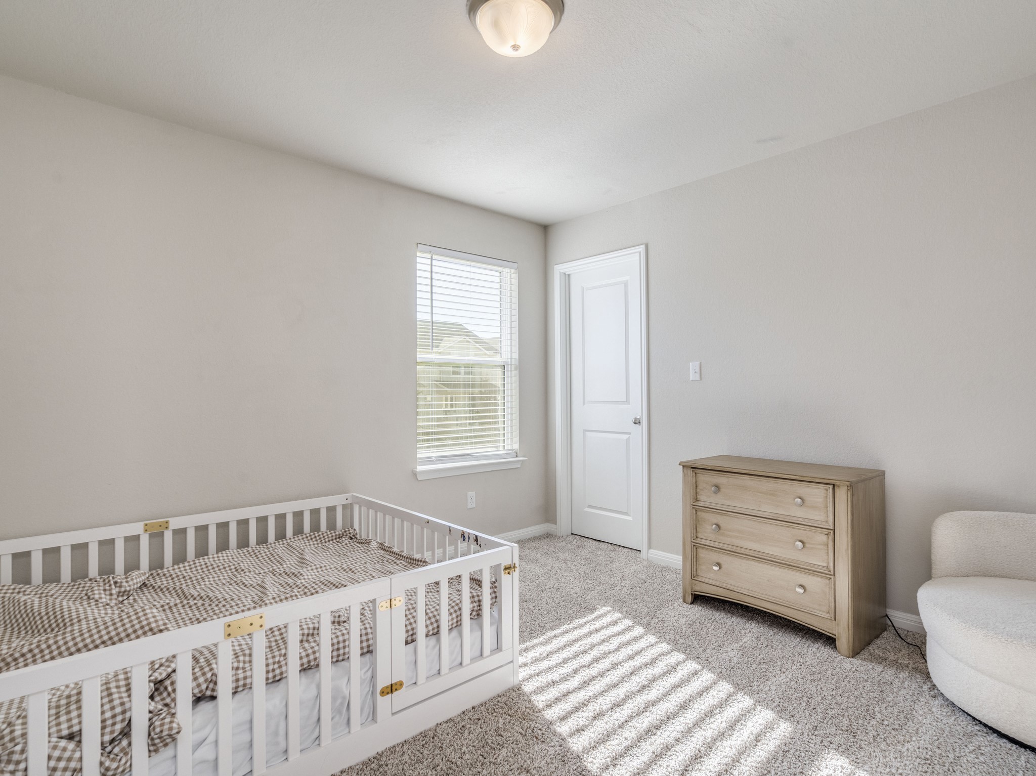 218 Glass Mountain Way Dripping Springs, TX 78620 - Photo 21 of 29 a bedroom with a bed and a window