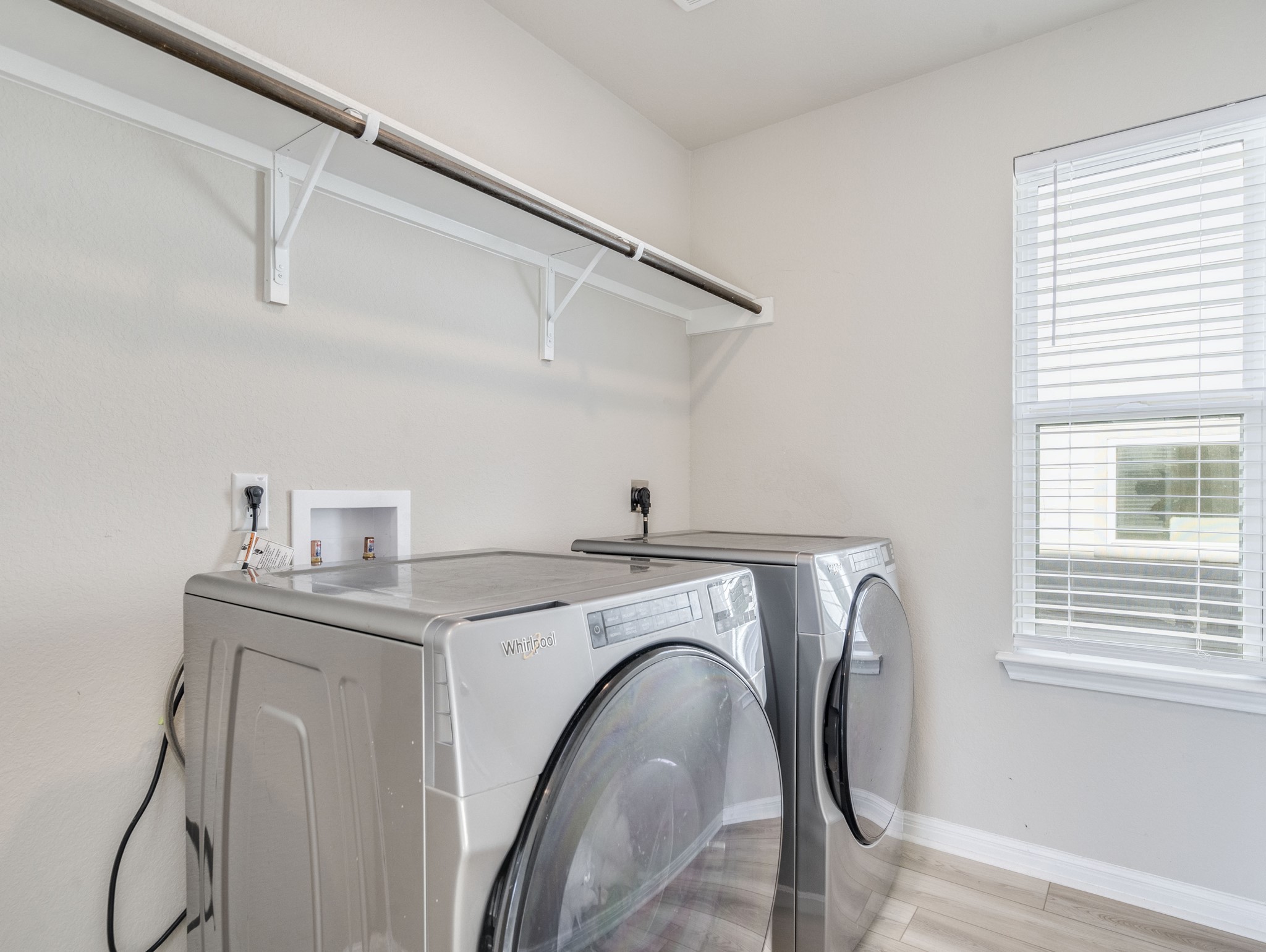 218 Glass Mountain Way Dripping Springs, TX 78620 - Photo 26 of 29 a utility room with dryer and washer