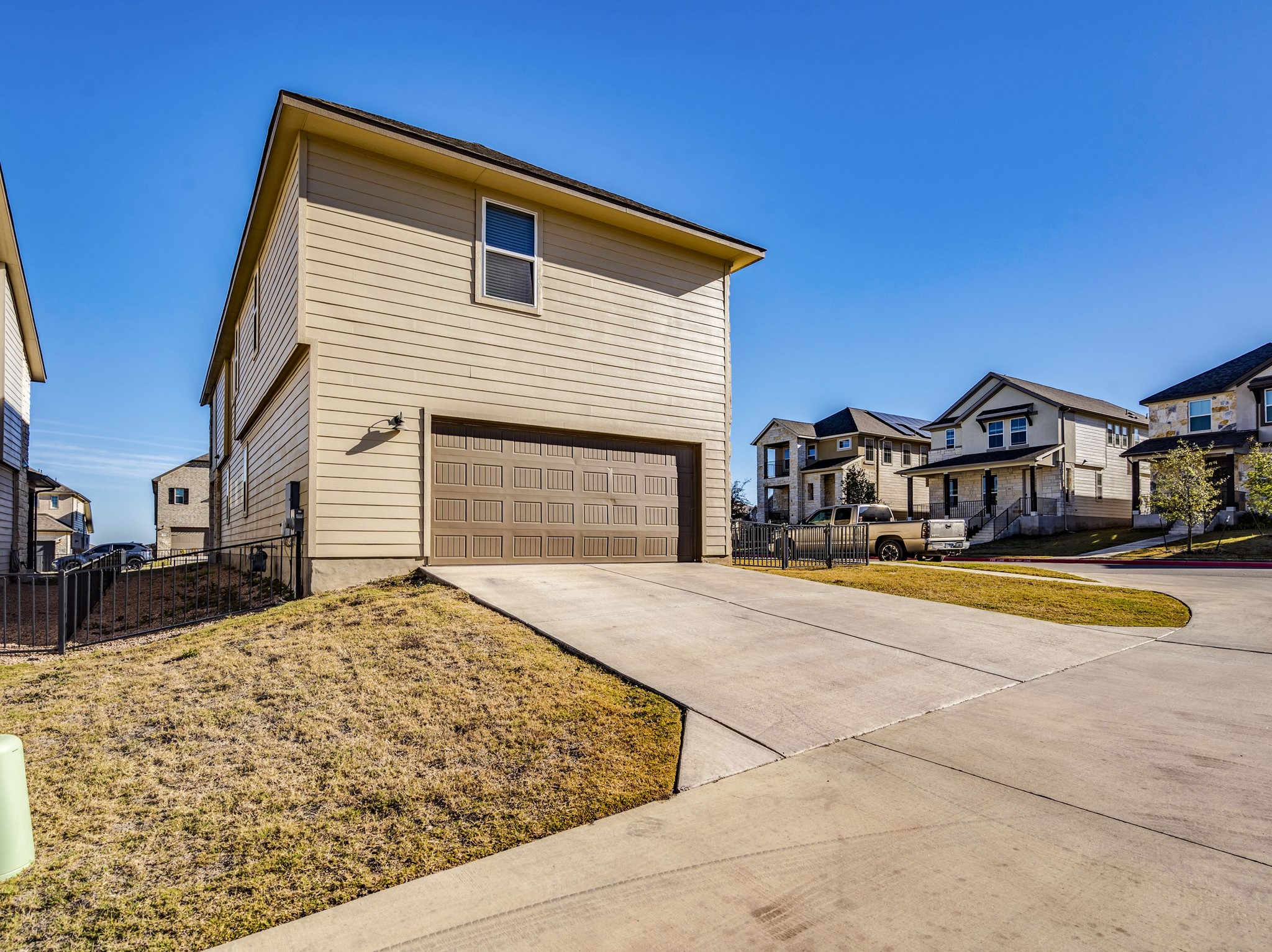 218 Glass Mountain Way Dripping Springs, TX 78620 - Photo 29 of 29 a front view of a house with a yard
