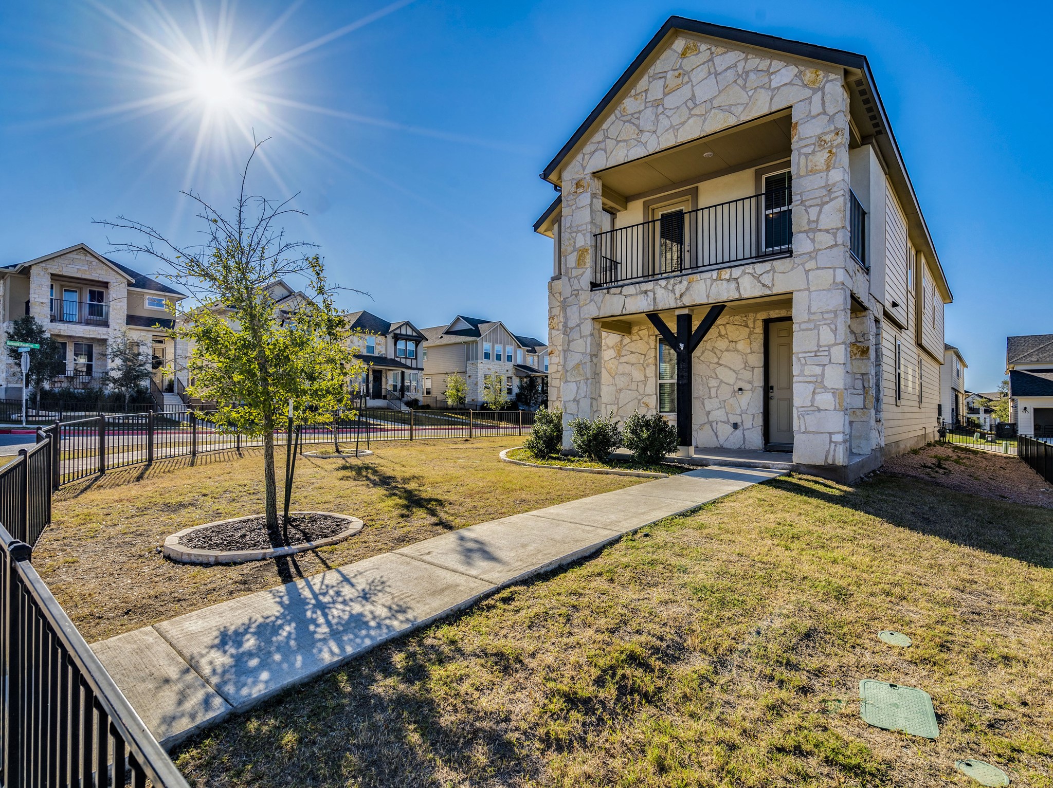 218 Glass Mountain Way Dripping Springs, TX 78620 - Photo 7 of 29 a house view with a swimming pool