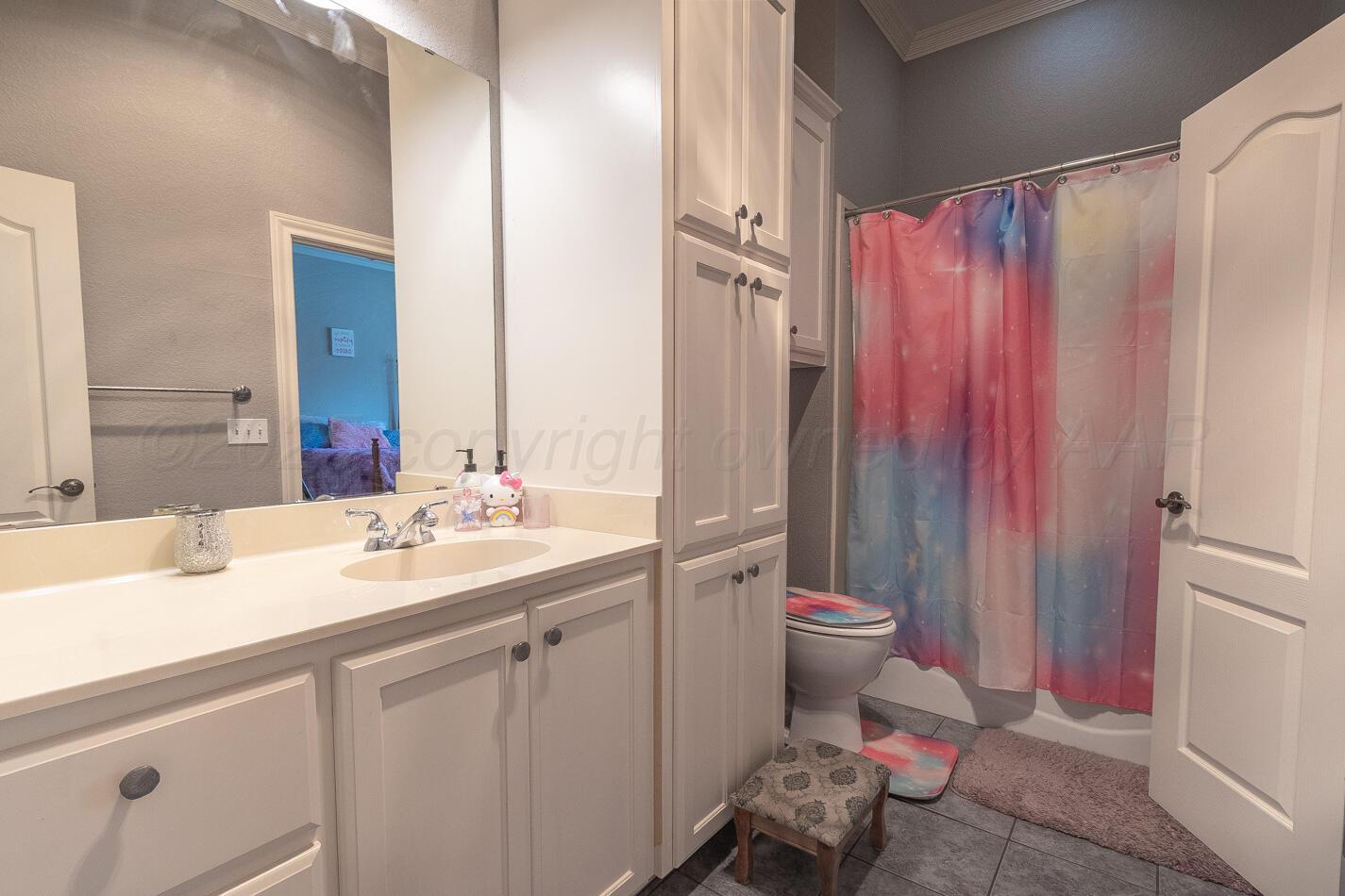 7500 Bayswater Road Amarillo, TX 79119 - Photo 19 of 46 a bathroom with a sink toilet and shower