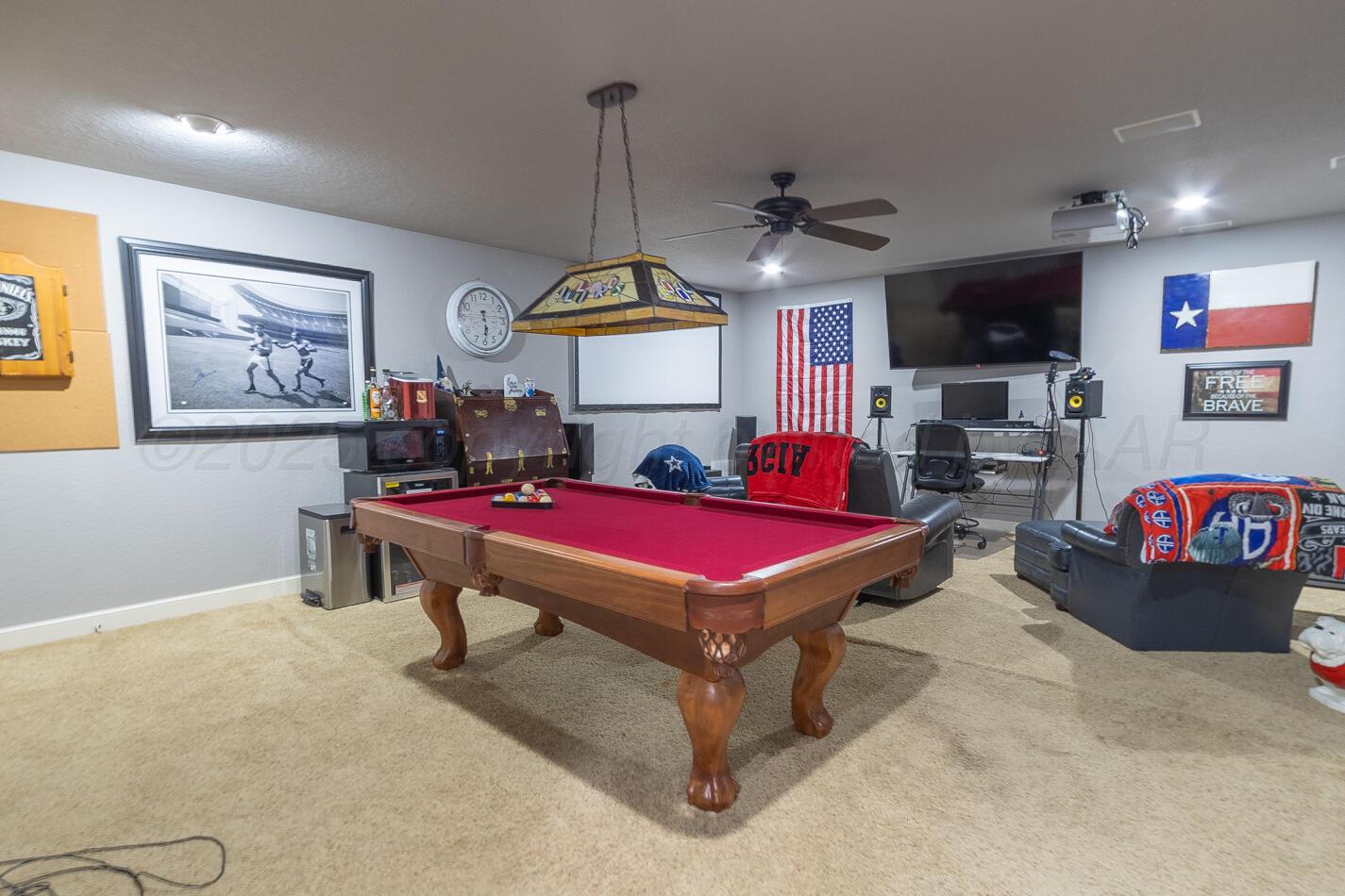 7500 Bayswater Road Amarillo, TX 79119 - Photo 23 of 46 a room with gym equipment and a flat screen tv