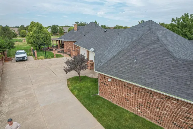 a aerial view of a house with a yard