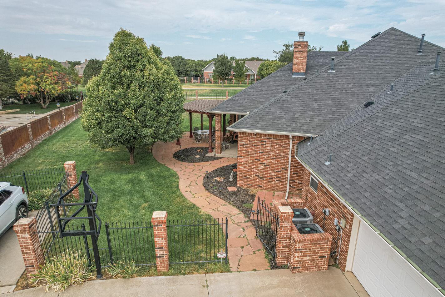 7500 Bayswater Road Amarillo, TX 79119 - Photo 45 of 46 a aerial view of a house with a yard