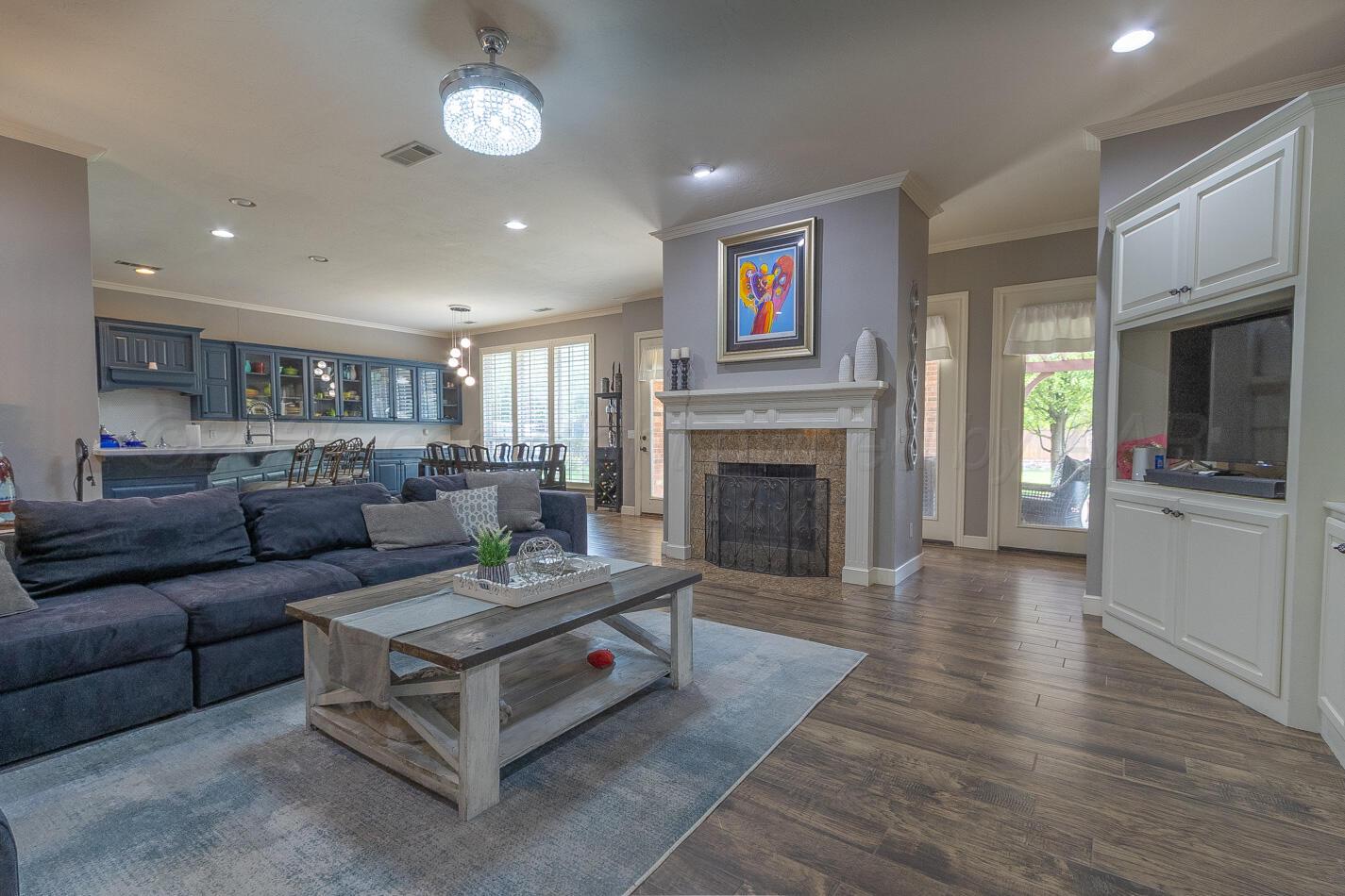 7500 Bayswater Road Amarillo, TX 79119 - Photo 7 of 46 a living room with furniture and a fireplace