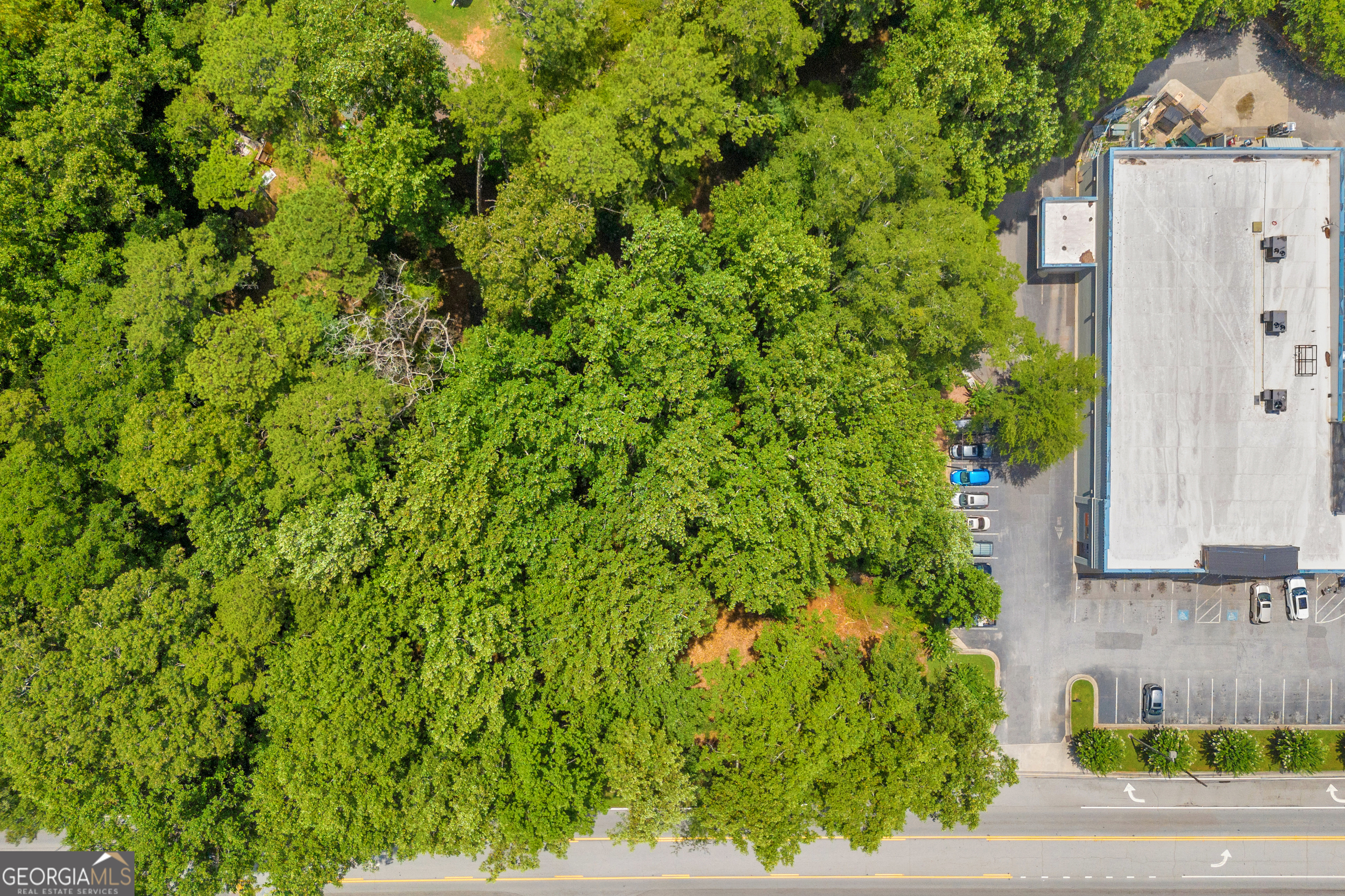 701 West Spring Street Monroe, GA 30655 - Photo 12 of 14 a view of a house with a yard