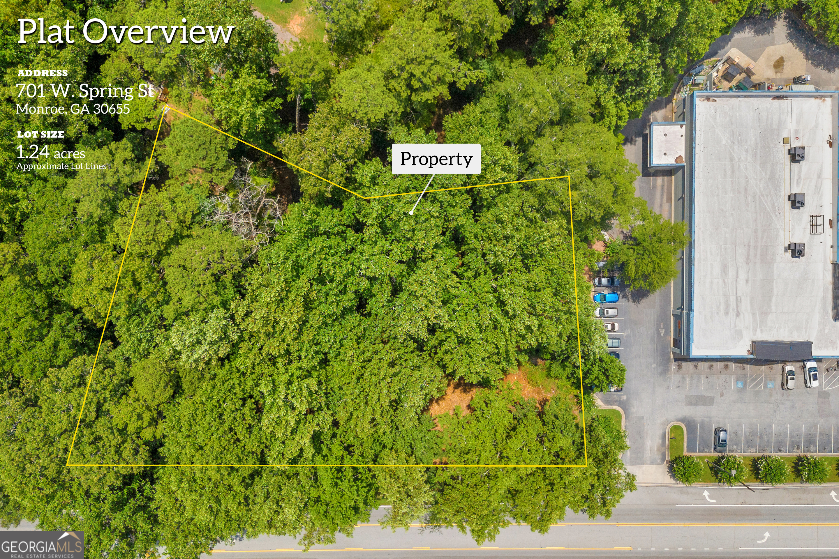 701 West Spring Street Monroe, GA 30655 - Photo 2 of 14 a sign that is sitting in front of a building