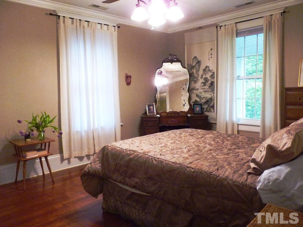 1324 Mordecai Drive Raleigh, NC 27604 - Photo 16 of 22 a bedroom with a bed and a window