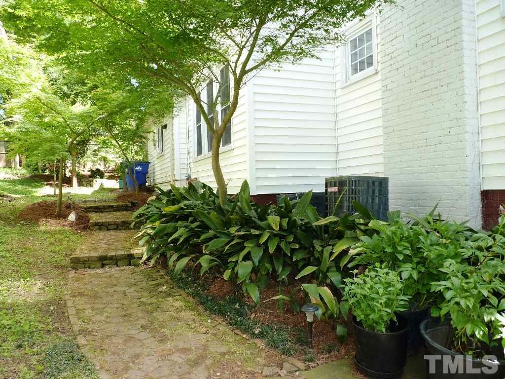 1324 Mordecai Drive Raleigh, NC 27604 - Photo 3 of 22 a view of a backyard with plants