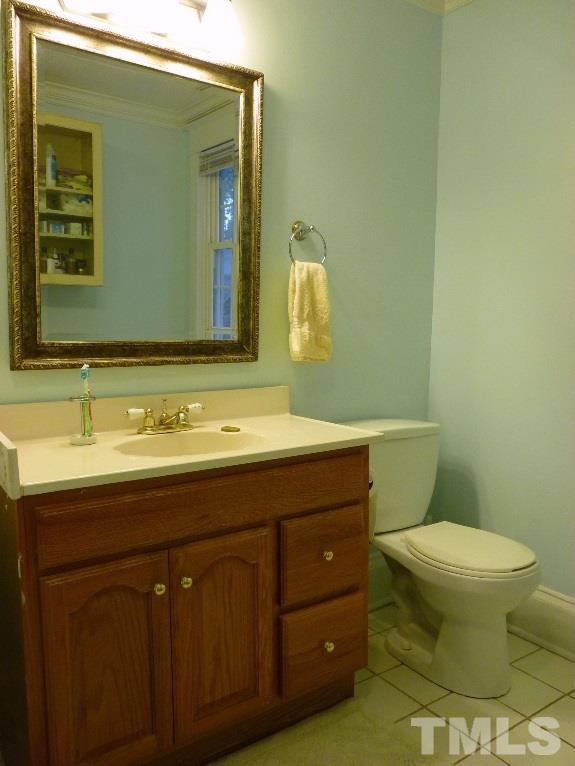 1324 Mordecai Drive Raleigh, NC 27604 - Photo 21 of 22 a bathroom with a granite countertop toilet sink and mirror