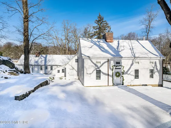 a view of a house with a snow