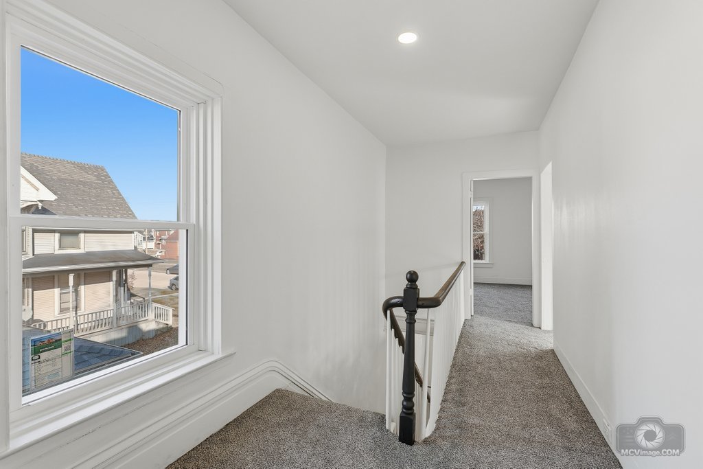 1009 Paul Street Ottawa, IL 61350 - Photo 11 of 25 a view of a livingroom with a chair and front door