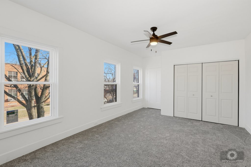 1009 Paul Street Ottawa, IL 61350 - Photo 12 of 25 a view of a livingroom with a ceiling fan & window