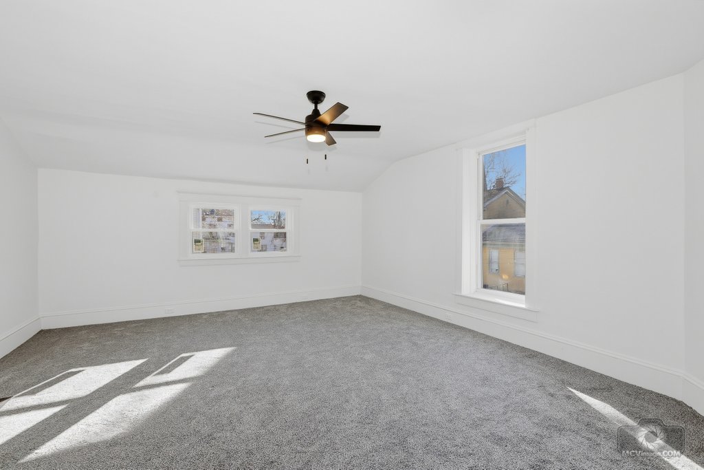 1009 Paul Street Ottawa, IL 61350 - Photo 15 of 25 an empty room with windows and fan