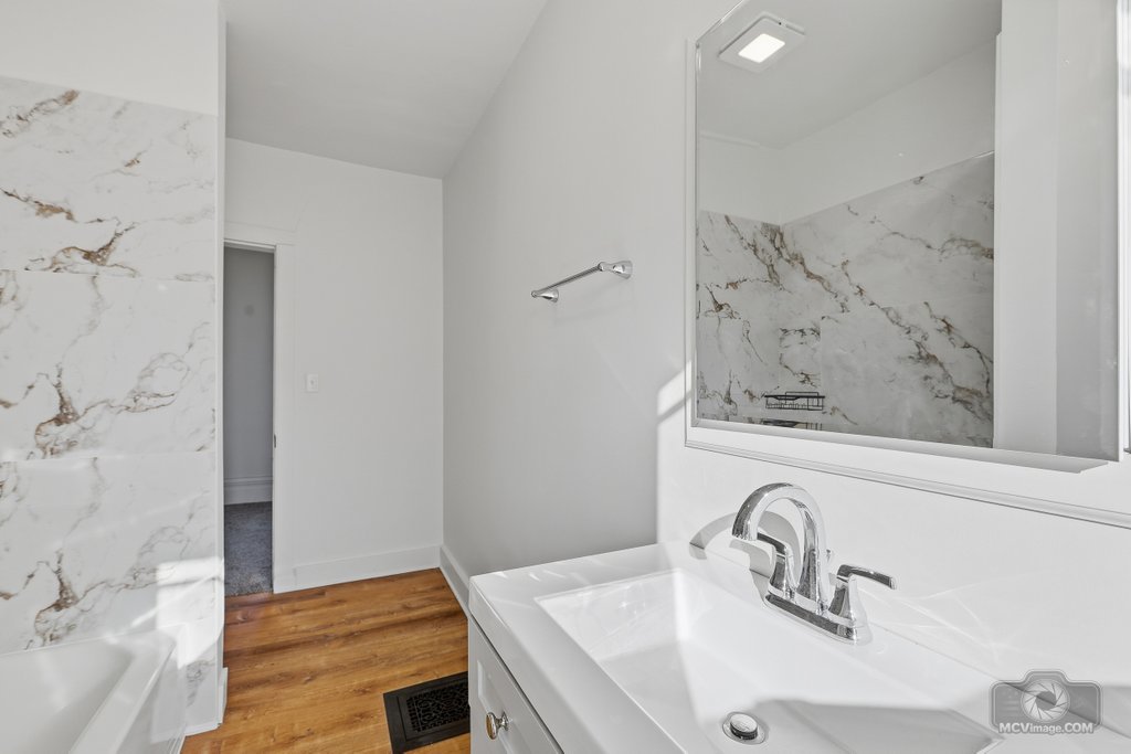 1009 Paul Street Ottawa, IL 61350 - Photo 18 of 25 a bathroom with a sink and a mirror