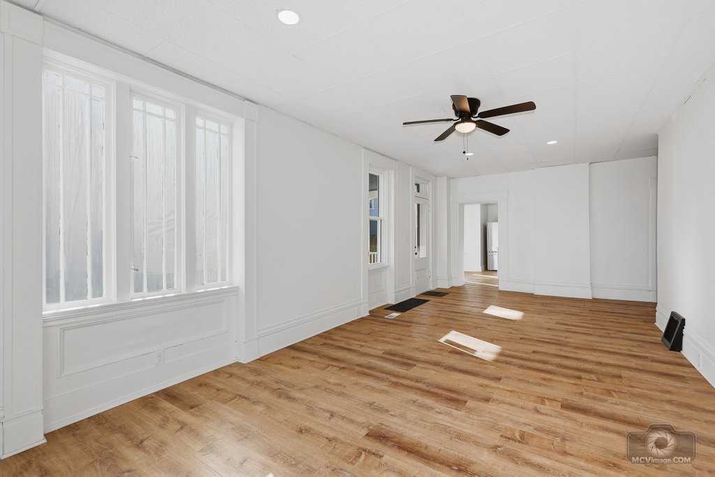 1009 Paul Street Ottawa, IL 61350 - Photo 4 of 25 a view of empty room with window and ceiling fan
