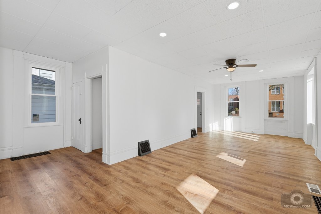 1009 Paul Street Ottawa, IL 61350 - Photo 5 of 25 a view of a livingroom with wooden floor and a large window