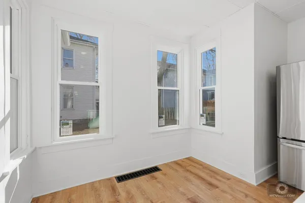 a view of empty room with windows
