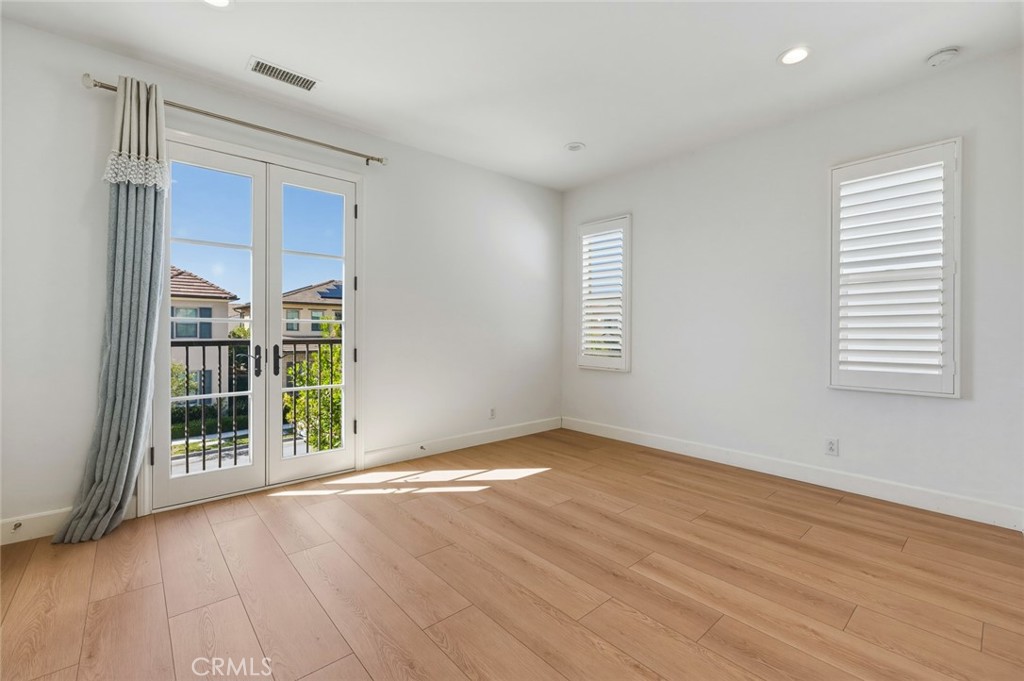 108 Henderson Irvine, CA 92620 - Photo 23 of 37 an empty room with wooden floor and windows