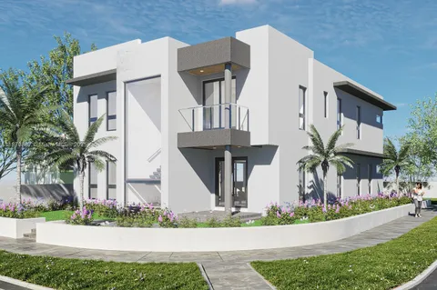 front view of house with a yard and potted plants