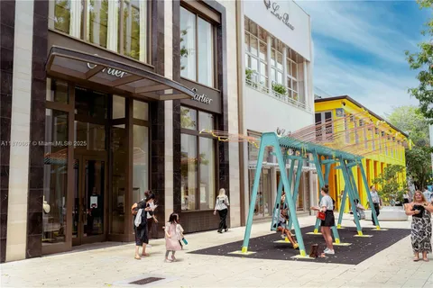 a view of a building with traffic signal lights