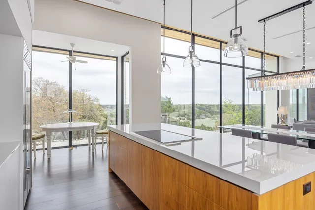 a bed sitting in a bedroom next to a large window