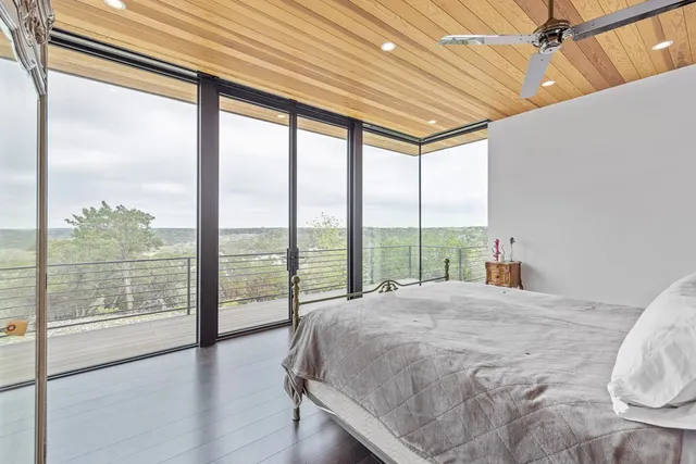 a living room with a large window and a table