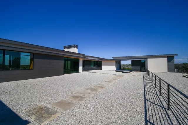a bedroom with a large bed and a large window