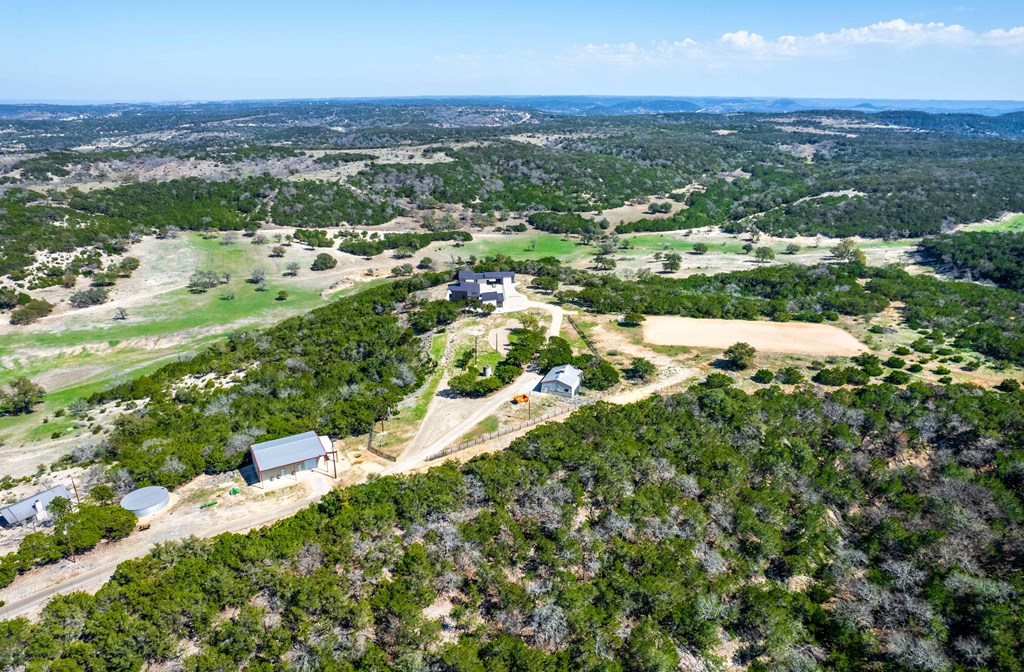 5081 Bandera Highway Center Point, TX 78010 - Photo 33 of 60 an aerial view of residential houses with outdoor space and trees