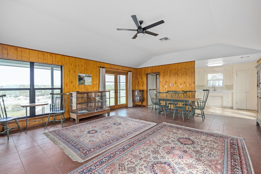 5081 Bandera Highway Center Point, TX 78010 - Photo 37 of 60 a living room with furniture a rug wooden floor and a large window