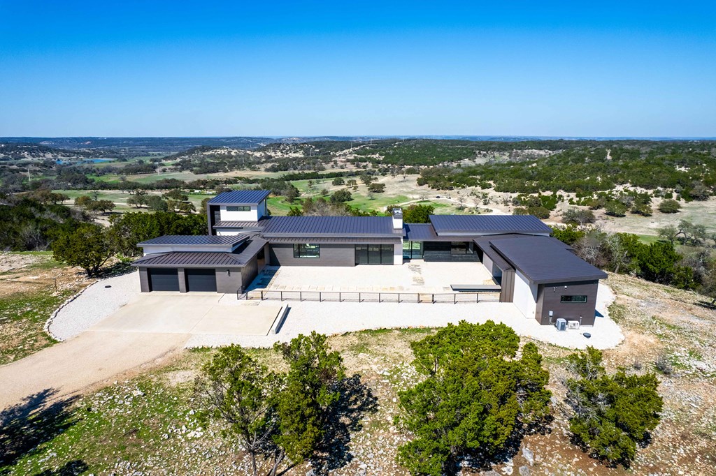 5081 Bandera Highway Center Point, TX 78010 - Photo 6 of 60 an aerial view of a house with a garden