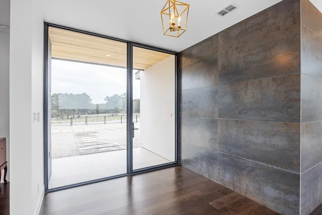 a dining room with furniture window and wooden floor