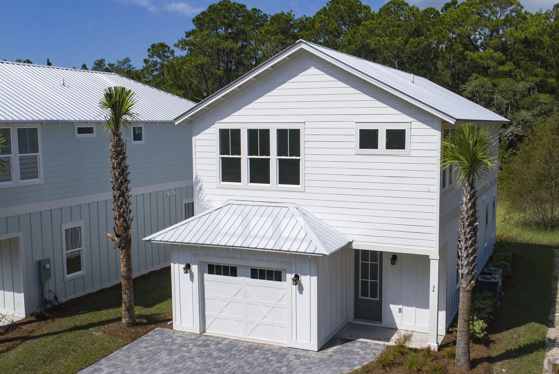 Lot #2 Lighthouse Pointe Boulevard Santa Rosa Beach, FL 32459 - Photo 1 of 26 a front view of a house with a garden