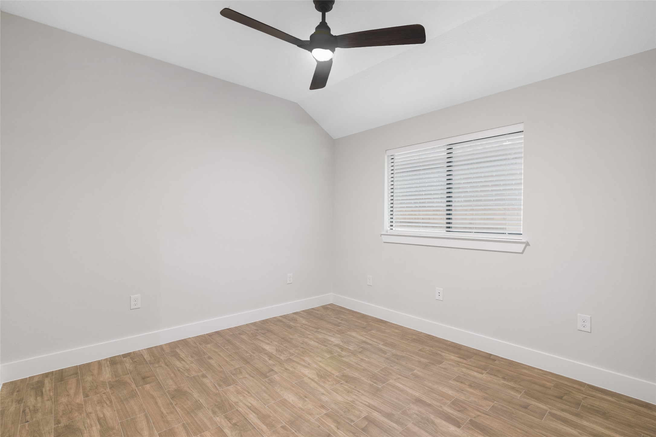 13018 Walden Road, Unit A Montgomery, TX 77356 - Photo 15 of 32 a view of a room with wooden floor and windows