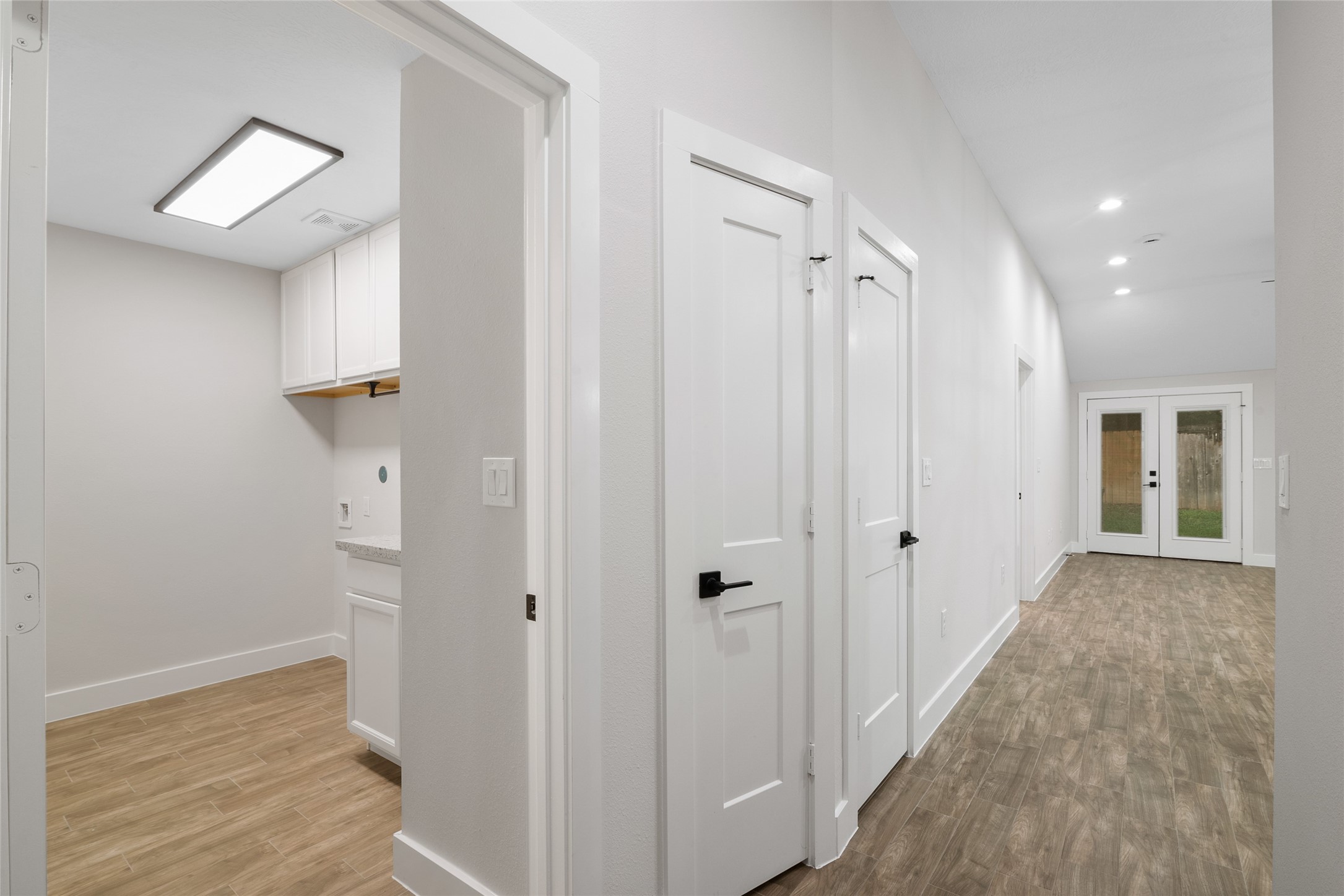 13018 Walden Road, Unit A Montgomery, TX 77356 - Photo 18 of 32 a view of a hallway with wooden floor and closet area