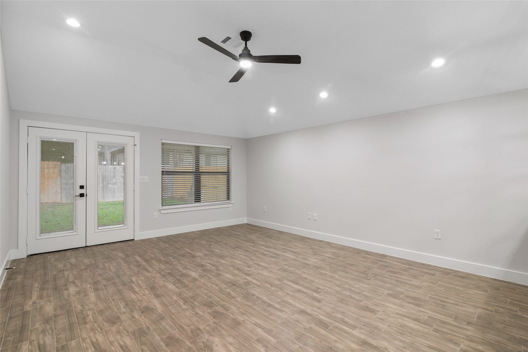 13018 Walden Road, Unit A Montgomery, TX 77356 - Photo 19 of 32 a view of an empty room with a window