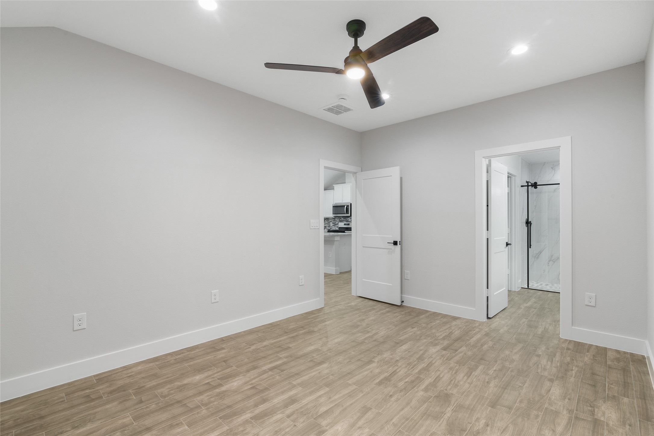 13018 Walden Road, Unit A Montgomery, TX 77356 - Photo 20 of 32 wooden floor in an empty room