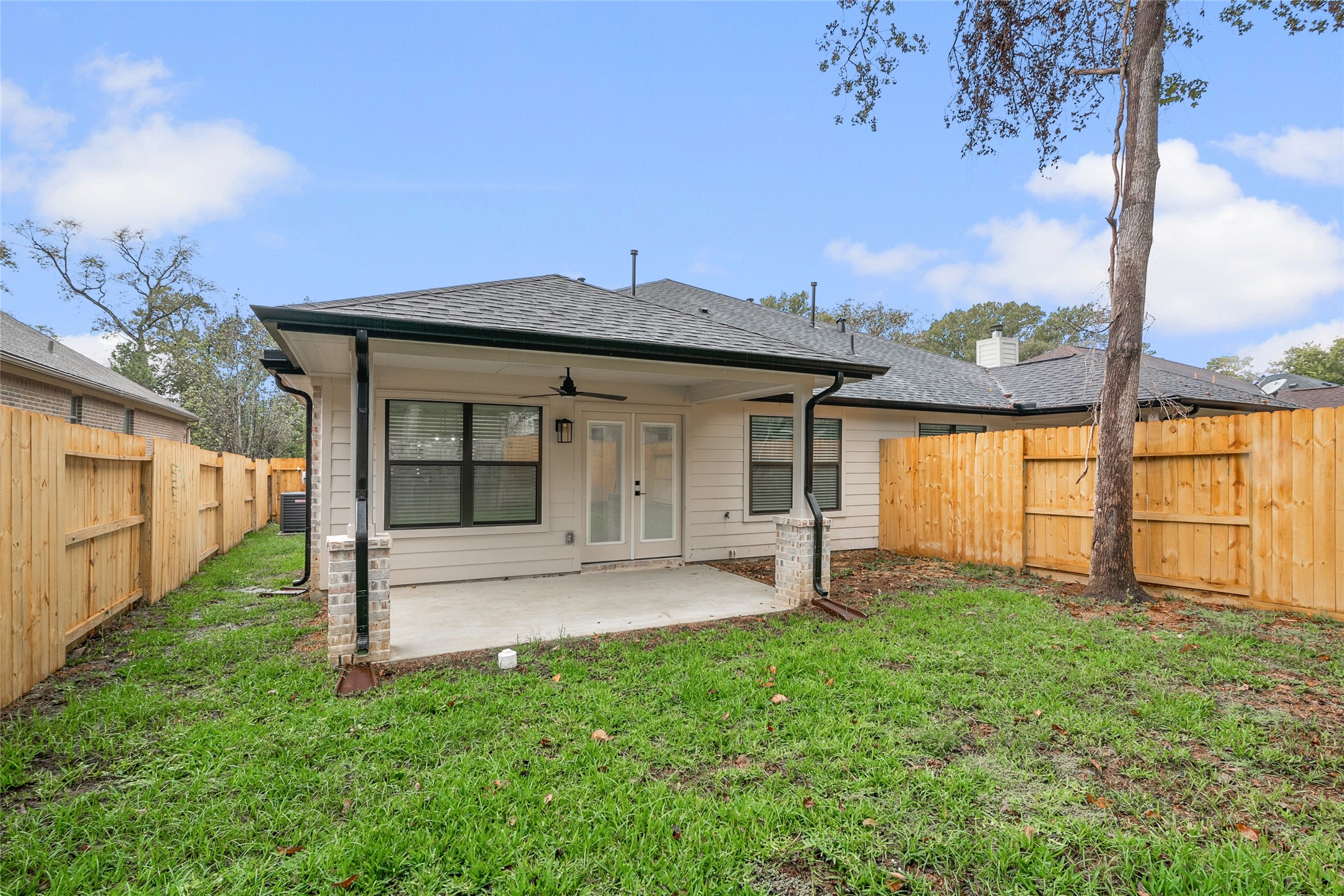 13018 Walden Road, Unit A Montgomery, TX 77356 - Photo 25 of 32 a view of a house with a yard and sitting area