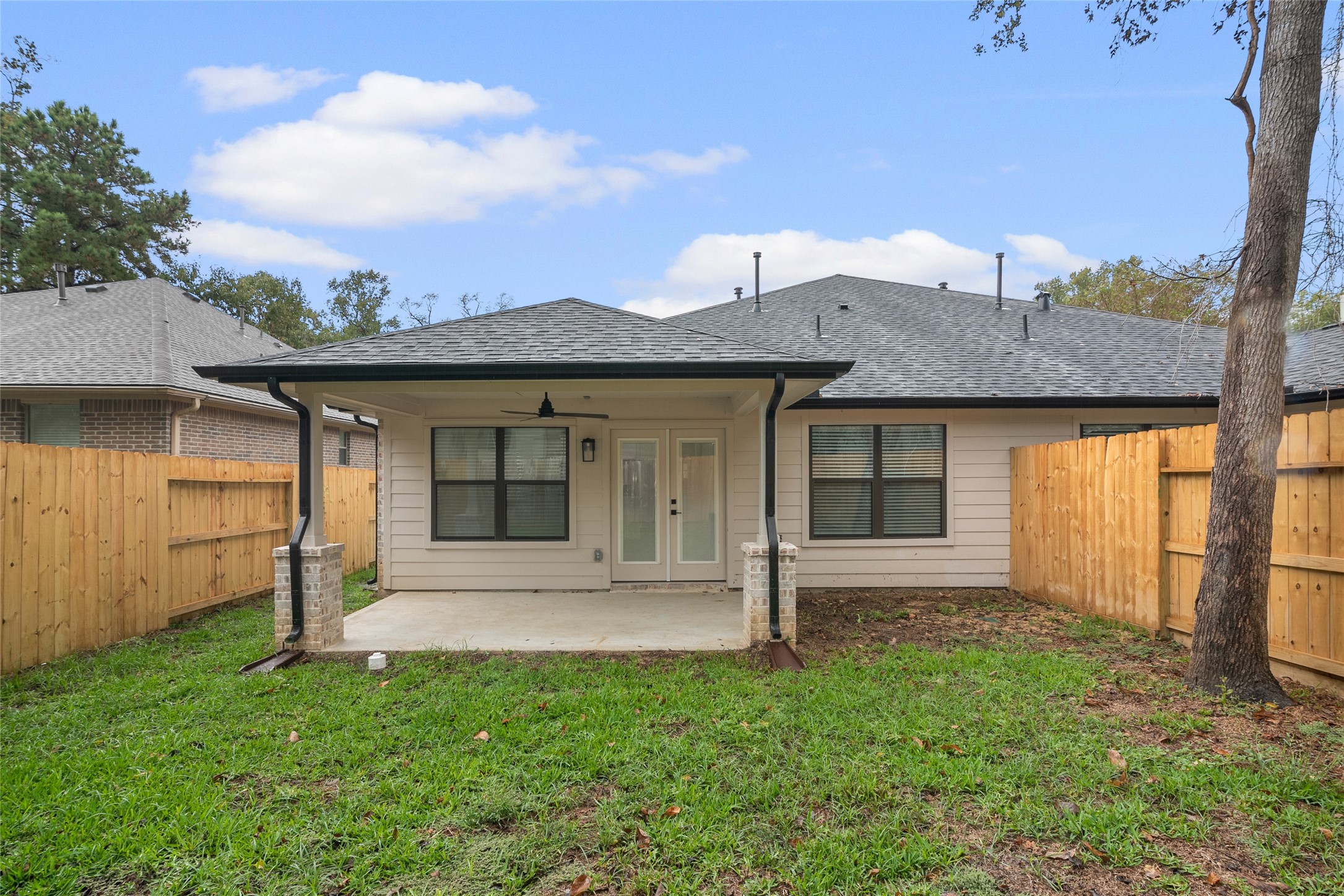 13018 Walden Road, Unit A Montgomery, TX 77356 - Photo 26 of 32 a front view of a house with a garden