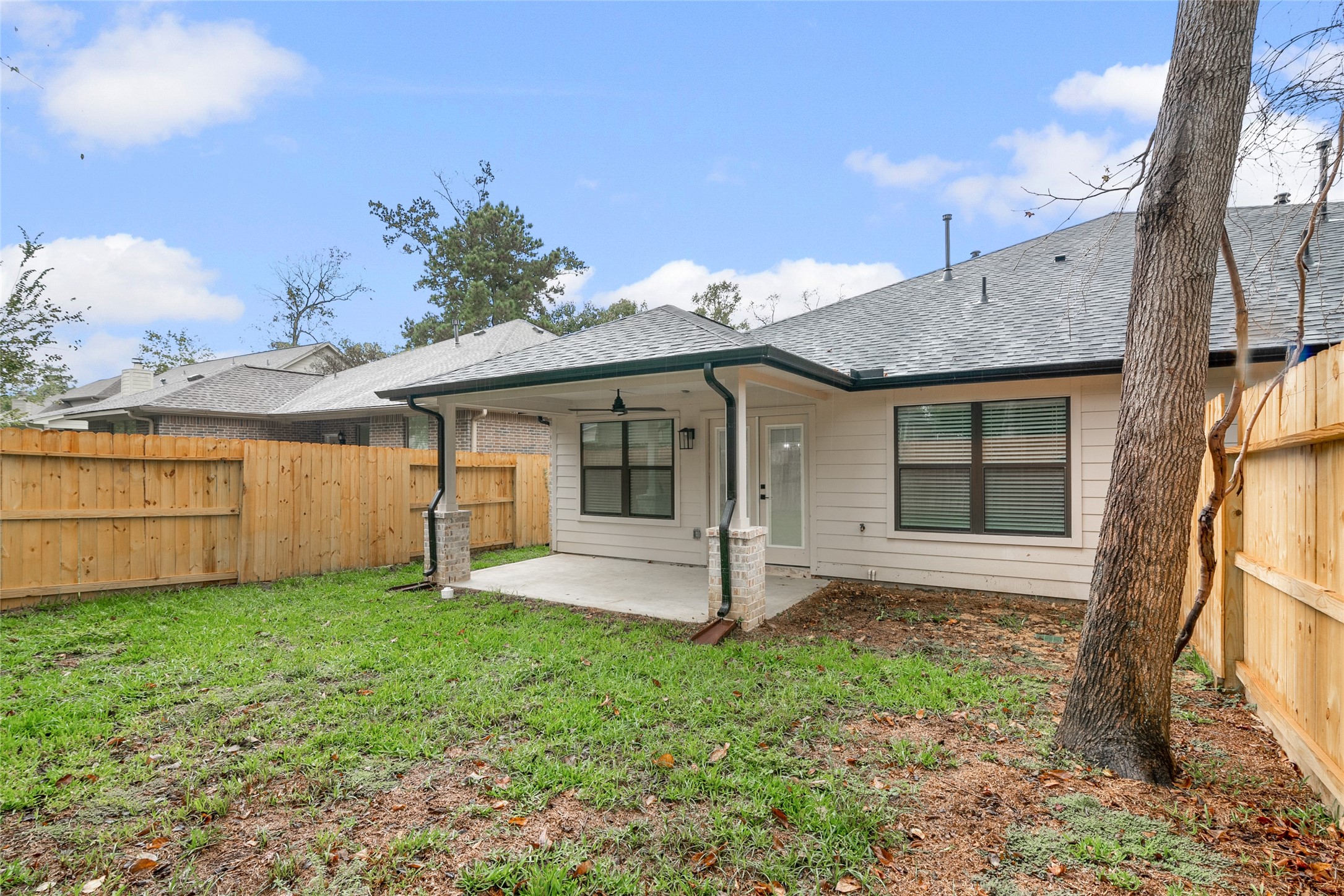 13018 Walden Road, Unit A Montgomery, TX 77356 - Photo 27 of 32 a front view of a house with a garden