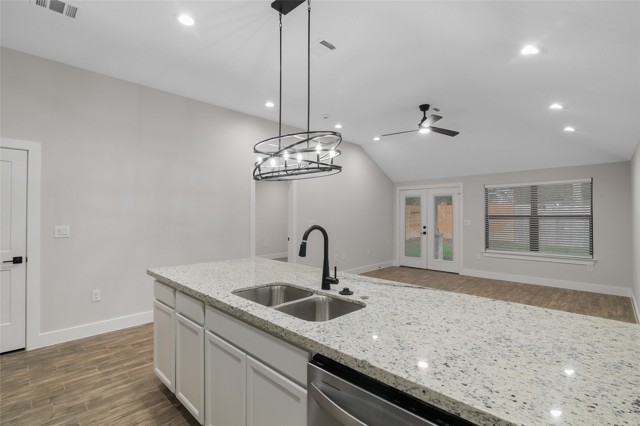 13018 Walden Road, Unit A Montgomery, TX 77356 - Photo 8 of 32 a kitchen with a sink a counter space and cabinets