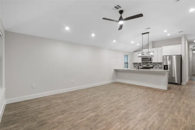 a view of kitchen with microwave and window
