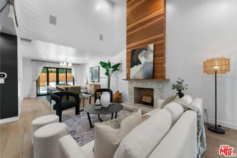 a living room with furniture fireplace and a fireplace