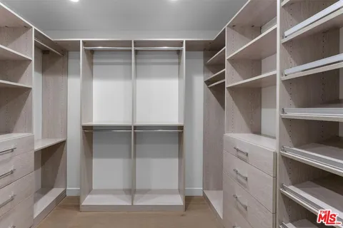 a view of an empty walk in closet