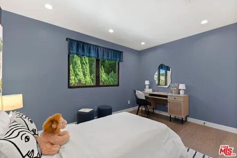 a bedroom with a bed and a table