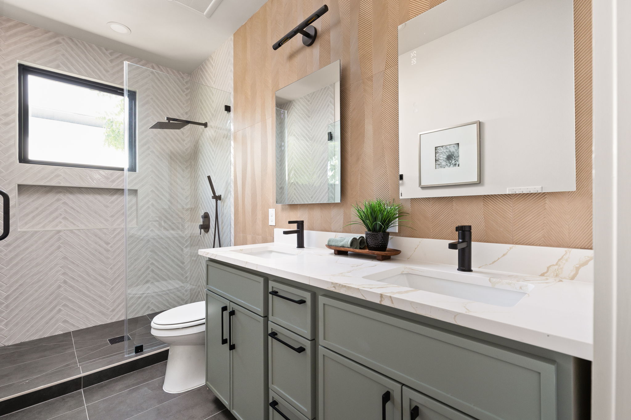 2717 Lyons Road, Unit 1 Austin, TX 78702 - Photo 20 of 40 Dual vanities with sleek black fixtures enhance this well-appointed bathroom.