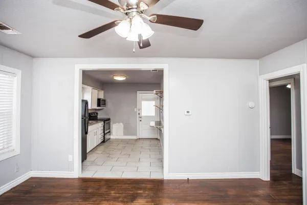 a view interior of a house and wooden floor a chandelier fan