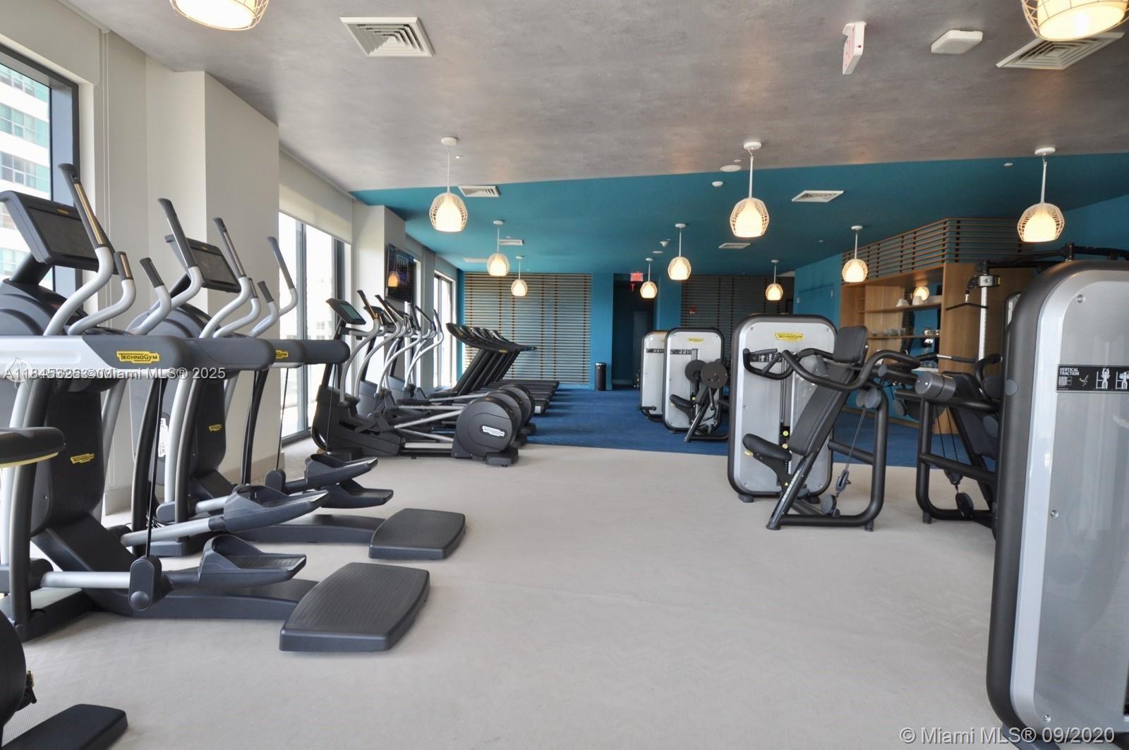 121 Northeast 34th Street, Unit 806 Miami, FL 33137 - Photo 22 of 22 a view of a room with gym equipment