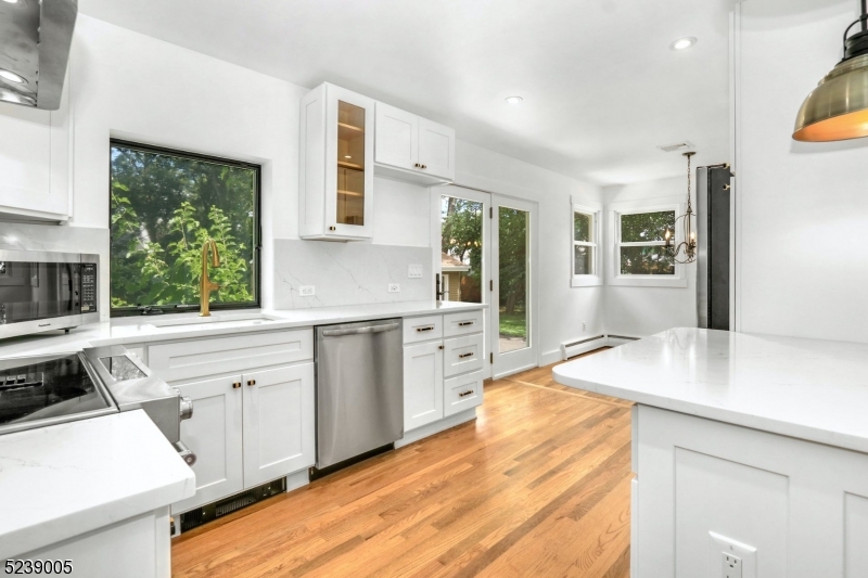 22 Morningside Road Woodbridge, NJ 07067 - Photo 12 of 27 a kitchen that has a sink a stove and a window