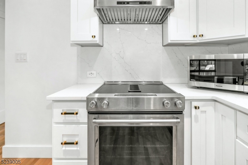 22 Morningside Road Woodbridge, NJ 07067 - Photo 15 of 27 a stove top oven sitting inside of a kitchen